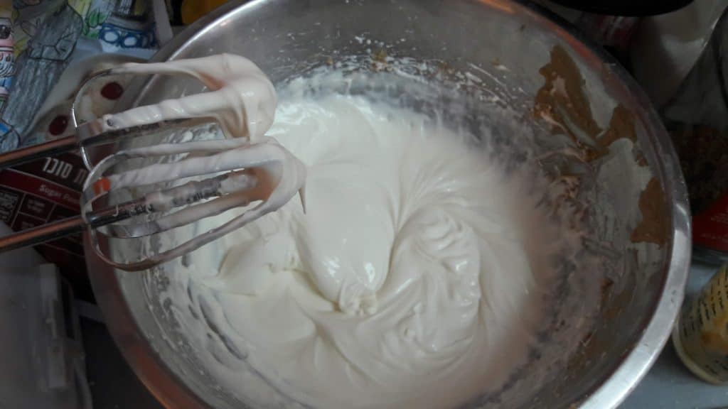 Fully whipped nondairy whipping cream and vanilla pudding powder in a bowl, for no bake peanut butter pie ~ bitesnpieces.co