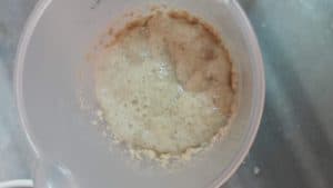 closeup shot of fully proofed, foamy yeast .